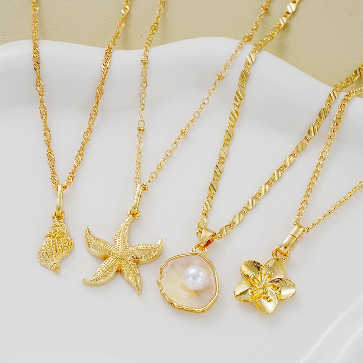 Includes 4 individual necklaces in one set. Wear them together or separately.